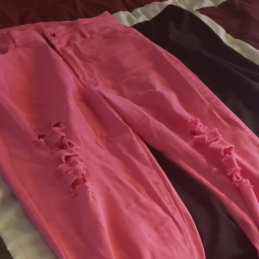 Pink distressed jeans